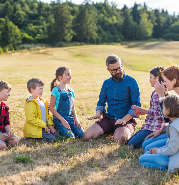 group-of-school-children-with-teacher-on-field-tri-2023-11-27-05-05-37-utc-scaled.jpg